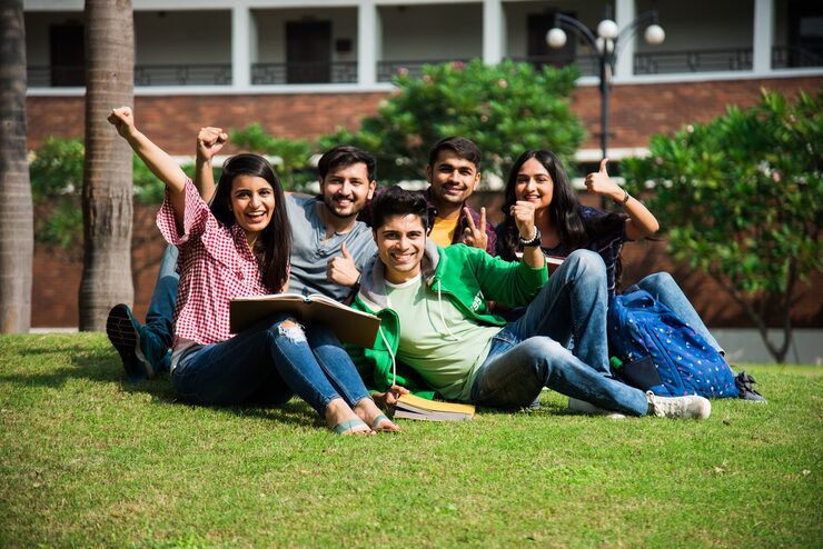 A group of Indian students together on their campus lawn